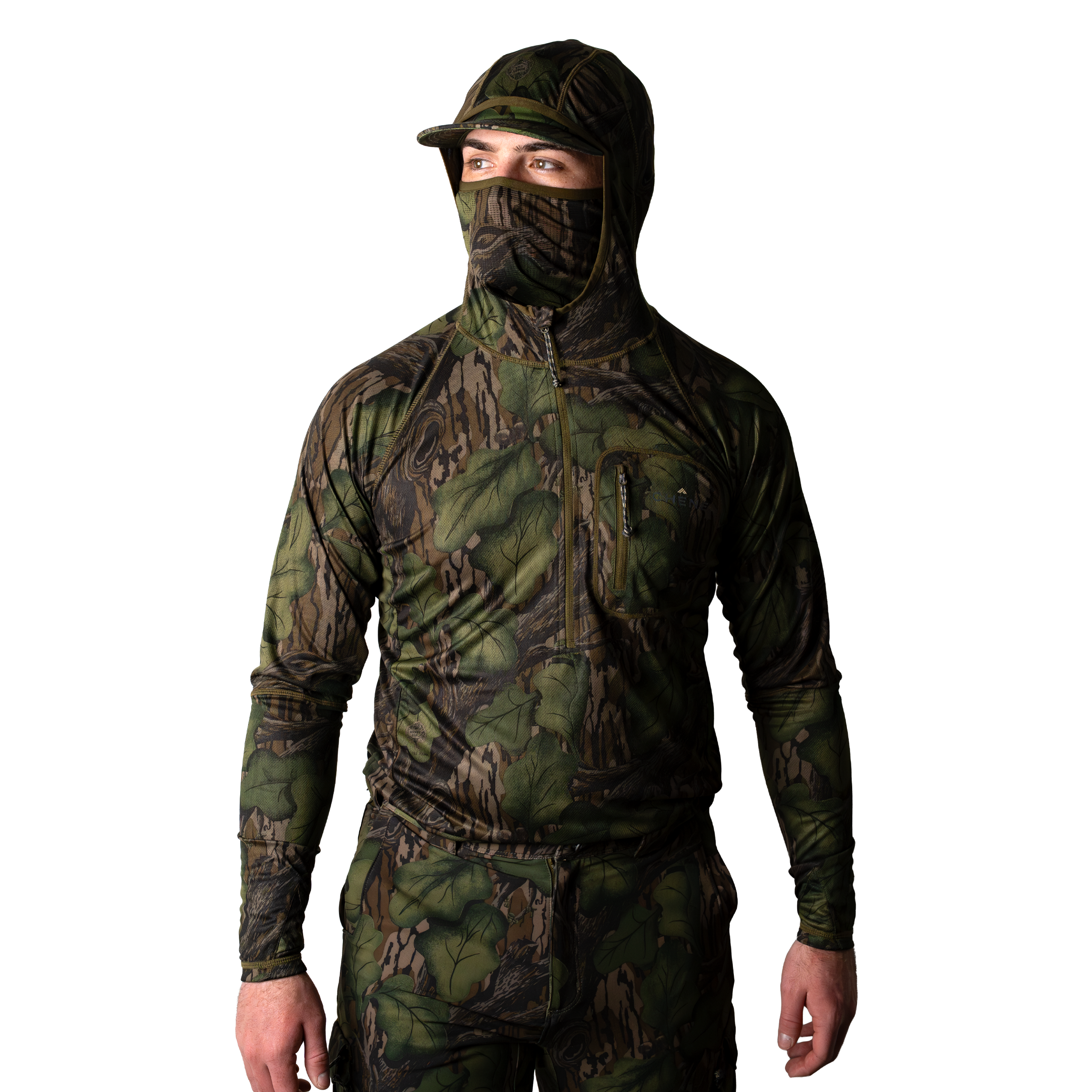 Model wearing a green and brown camouflage hoodie with built in face mask and brimmed cap, front body view on light background. #mossy_oak_full_foliage