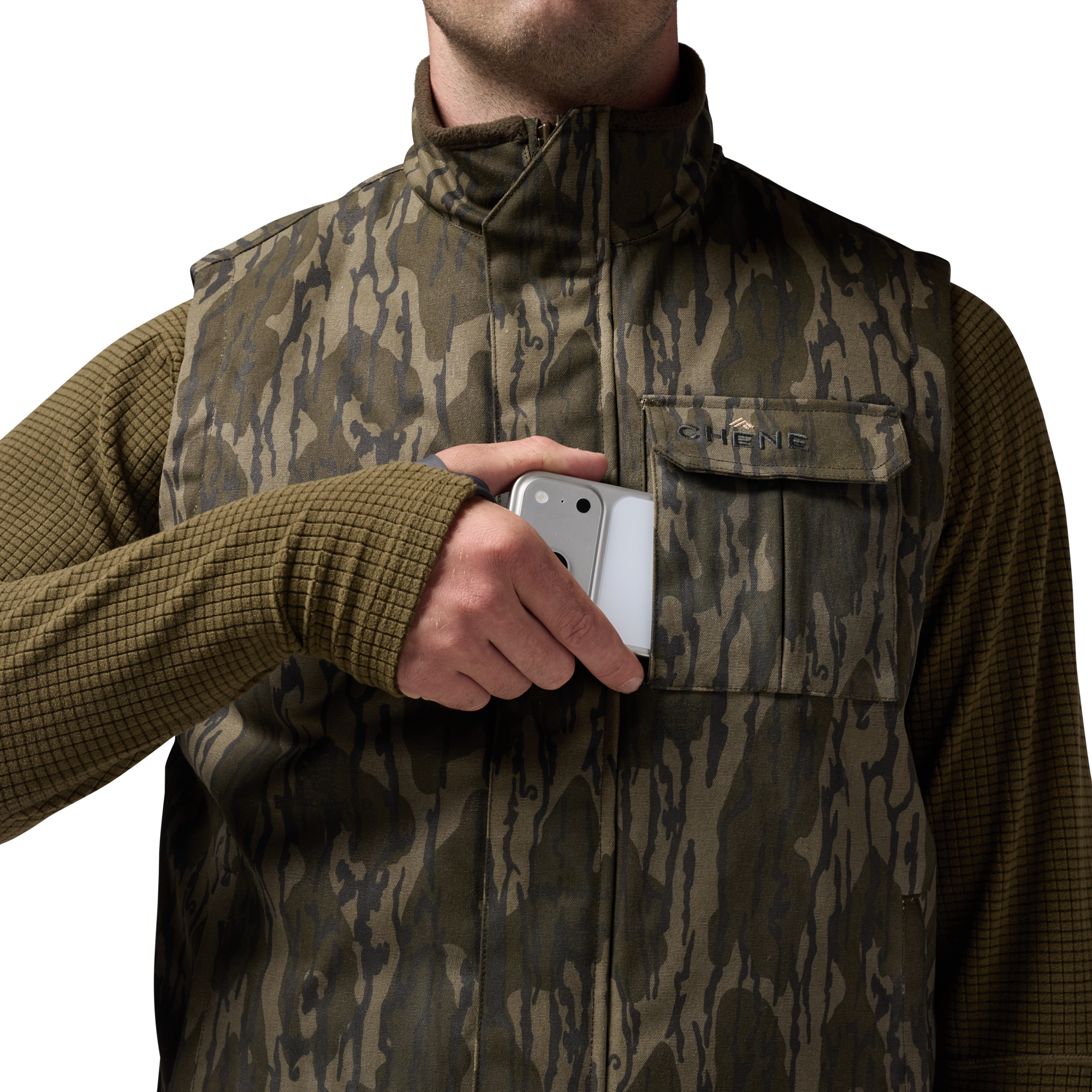 Waxed Canvas Goose Down Vest in Mossy Oak Original Bottomland, on model #mossy_oak_original_bottomland