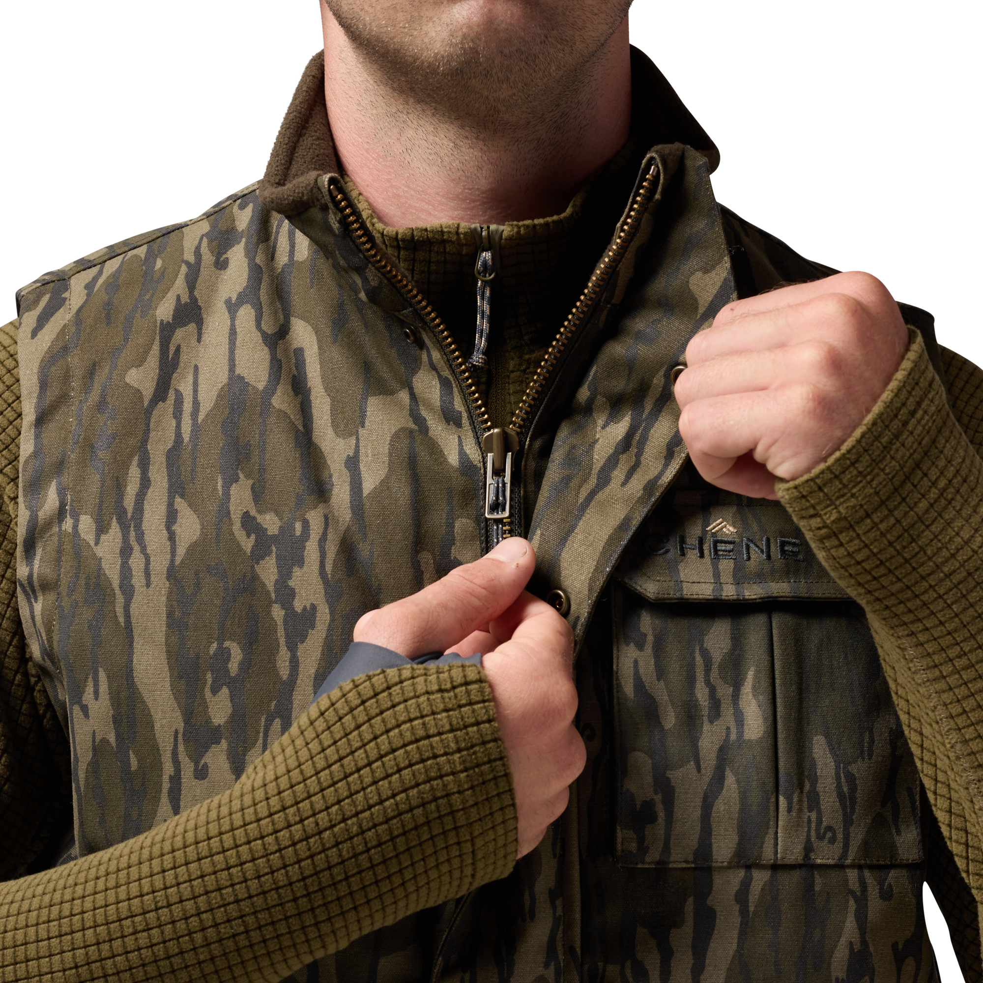 Waxed Canvas Goose Down Vest in Mossy Oak Original Bottomland, on model #mossy_oak_original_bottomland