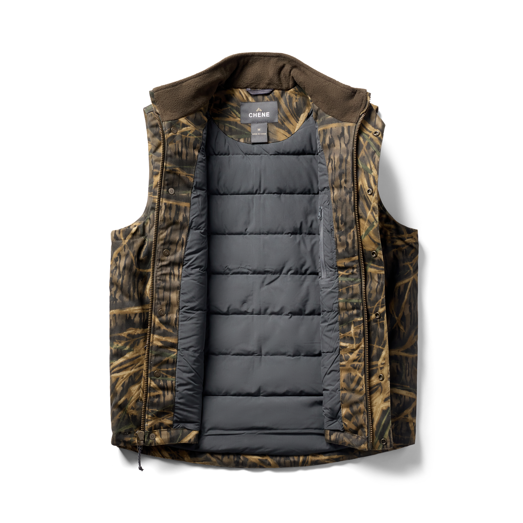 Waxed Canvas Goose Down Vest in Mossy Oak Original Shadow Grass, flat lay #mossy_oak_original_shadow_grass
