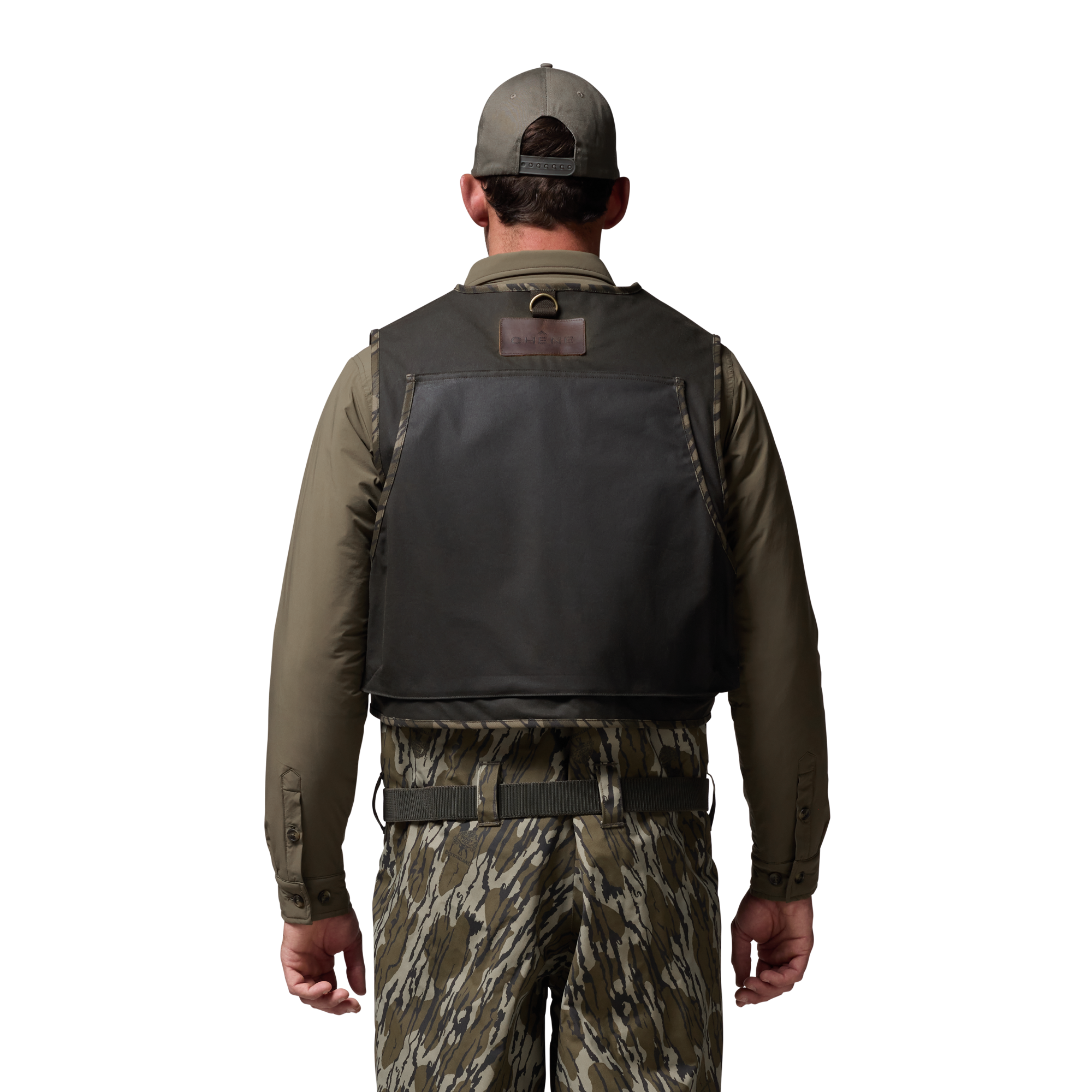 Waxed Canvas Wading Vest in Olive / Mossy Oak Original Bottomland, on model #olive_/_mossy_oak_original_bottomland
