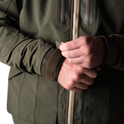 a person wearing a green jacket