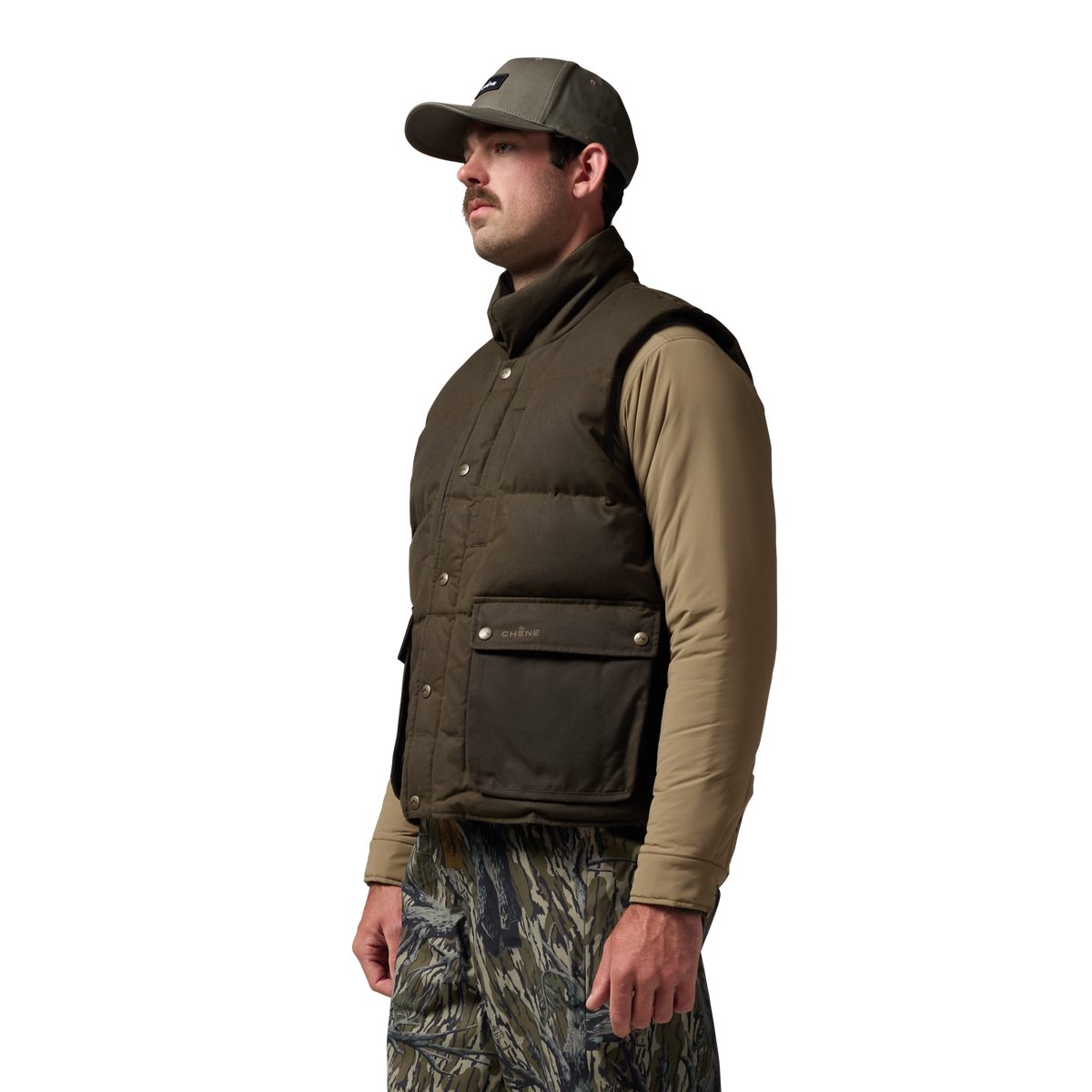 Founder's Reserve Waxed Down Vest in Dark Olive, on model #dark_olive