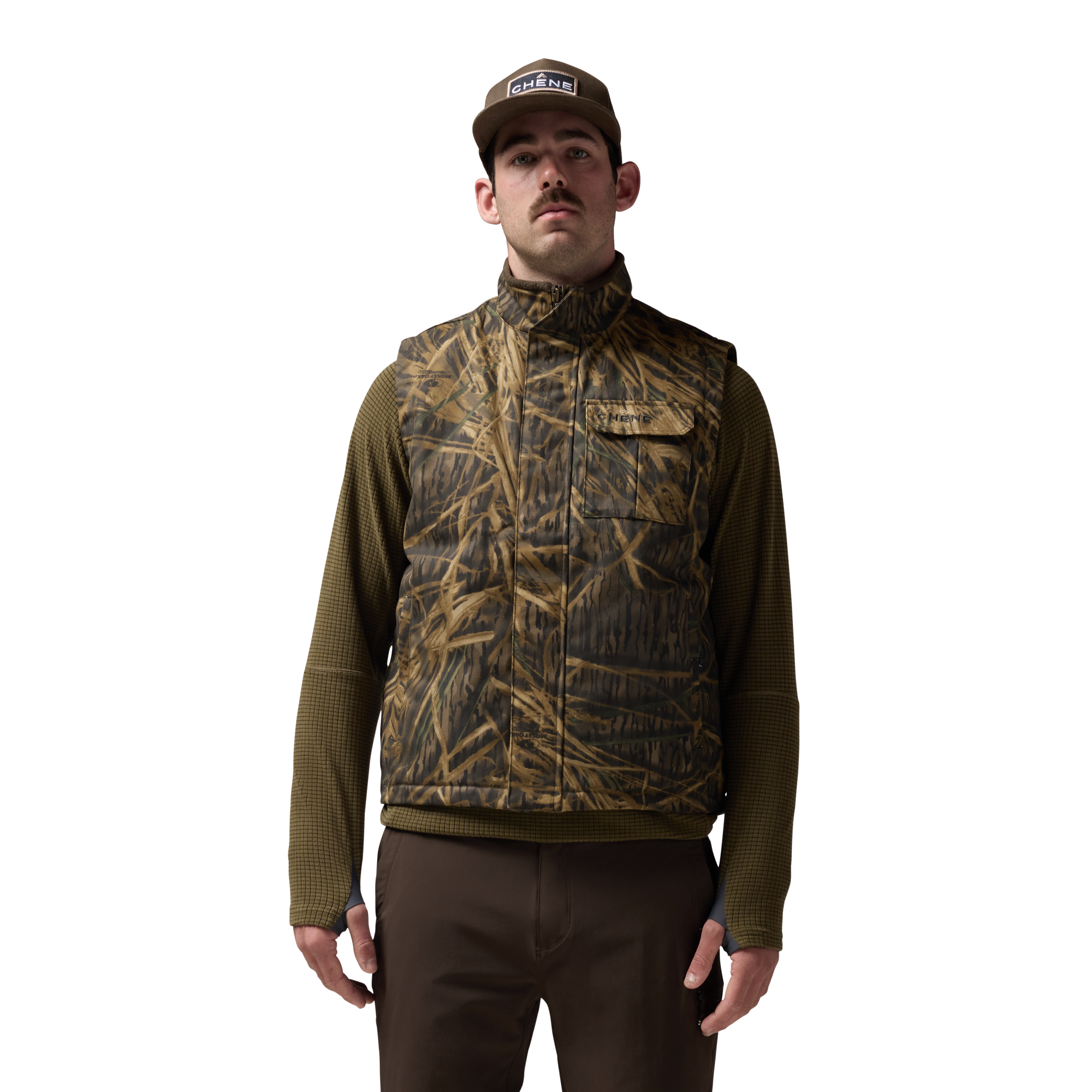Waxed Canvas Goose Down Vest in Mossy Oak Original Shadow Grass, on model #mossy_oak_original_shadow_grass