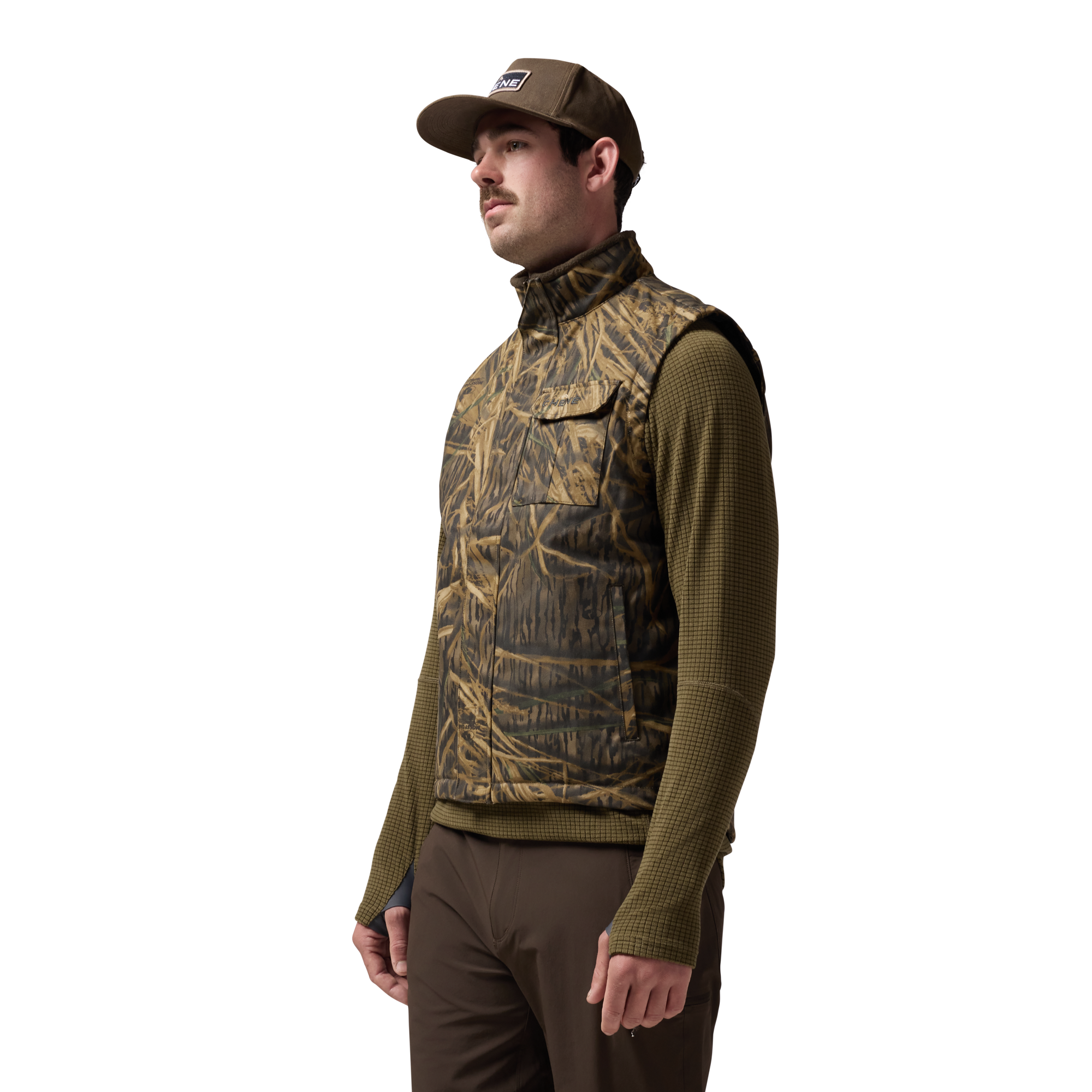Waxed Canvas Goose Down Vest in Mossy Oak Original Shadow Grass, on model #mossy_oak_original_shadow_grass
