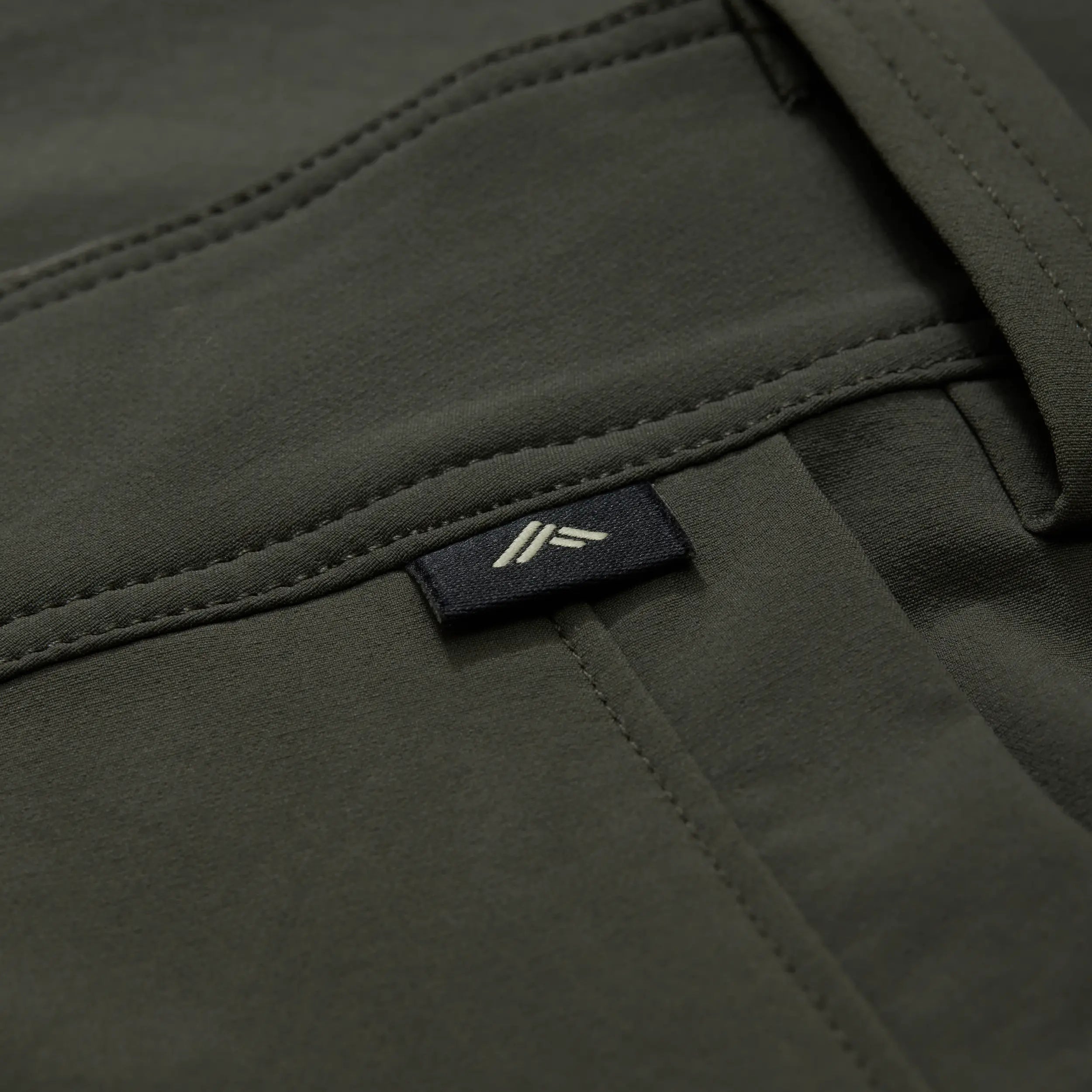 Chêne logo tag on green pant. #cypress