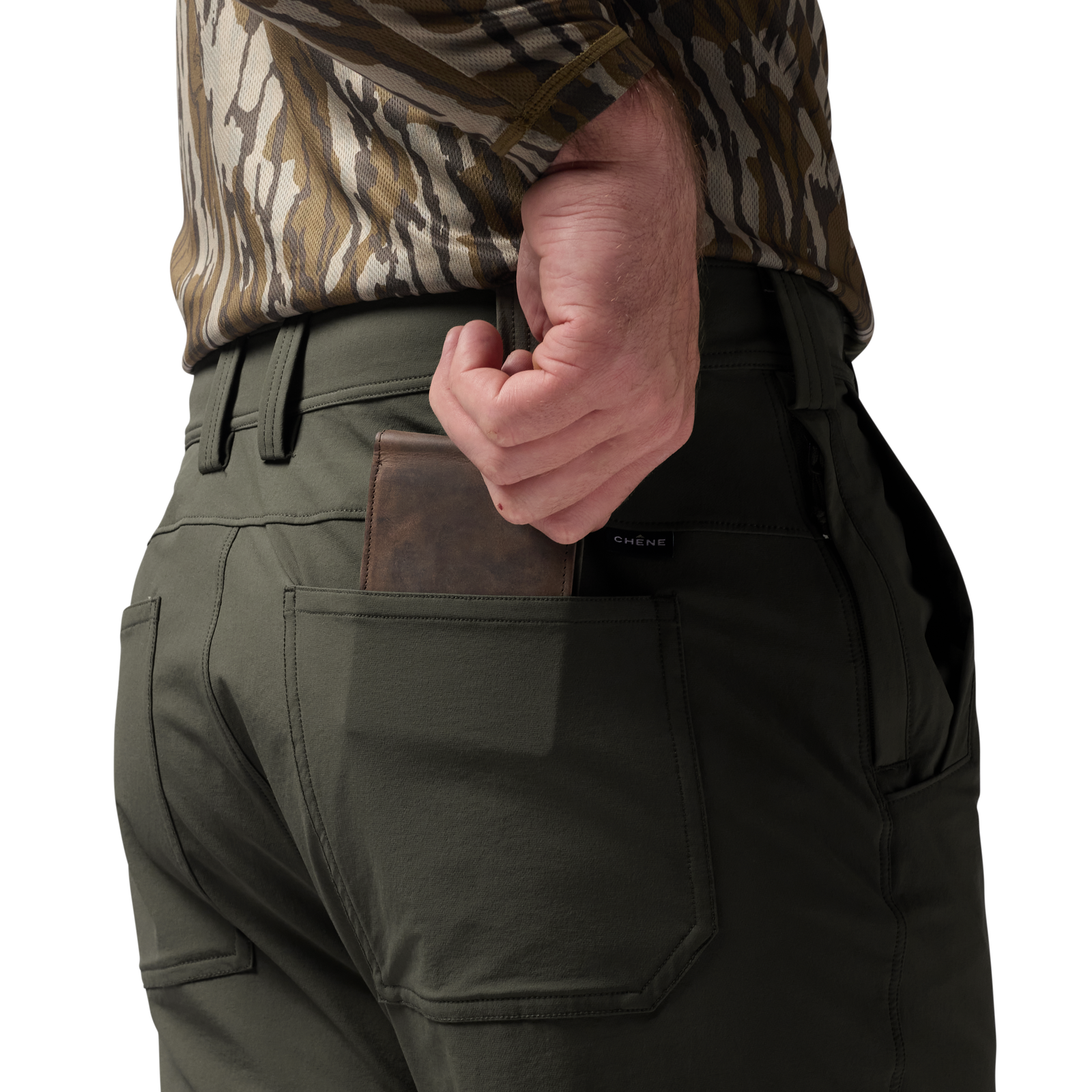 Person wearing green pants with a brown leather wallet in a pocket, camouflage shirt visible. #cypress