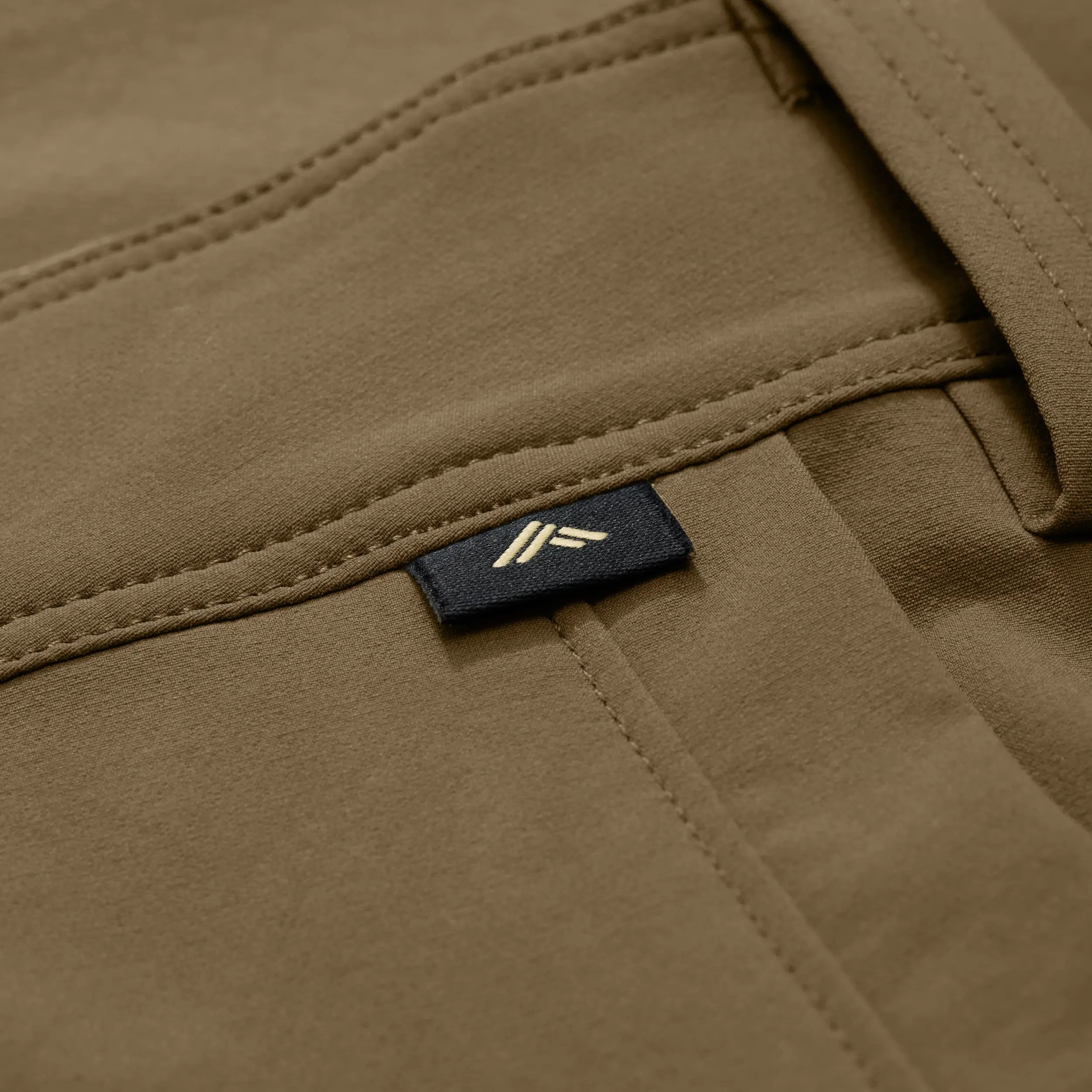 Chêne logo tag on tan pant. #field_khaki