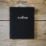 a black book on a wood surface